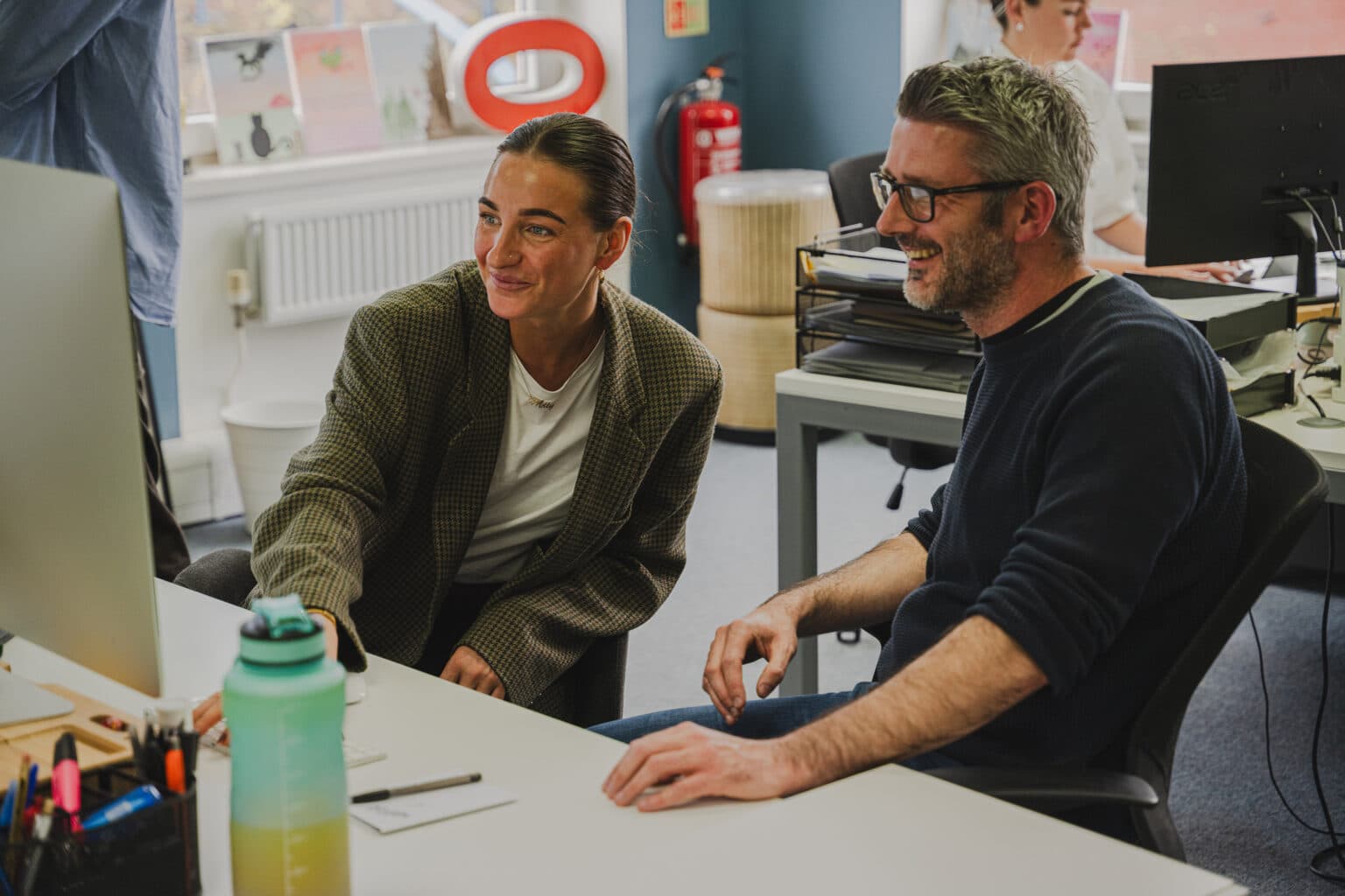 Team collaborating in We Are Fred studio workspace